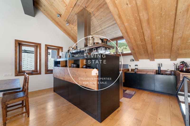 Open kitchen with wooden ceiling and wooden flooring, two windows, large island, modern appliances