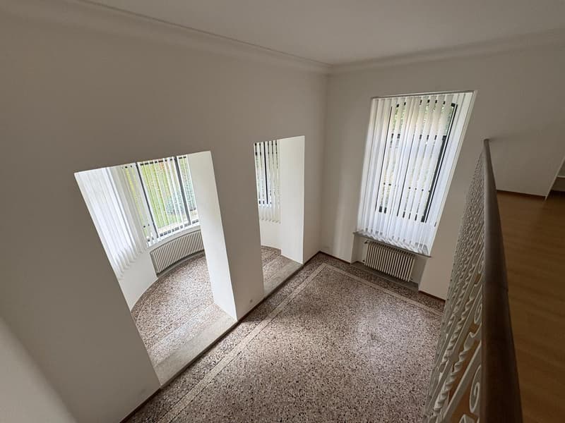 granite flooring, arched windows, radiators, staircase