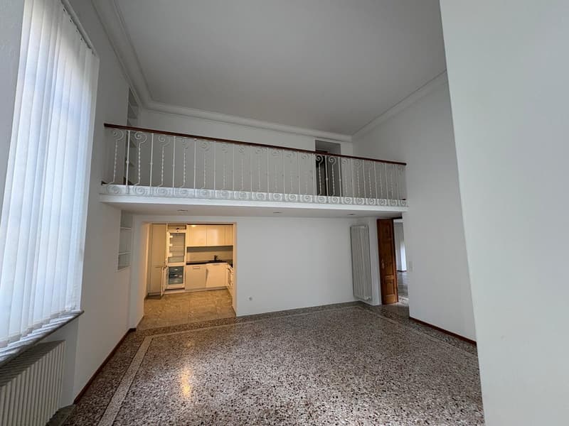 white walls, balcony with white railing, tile floor