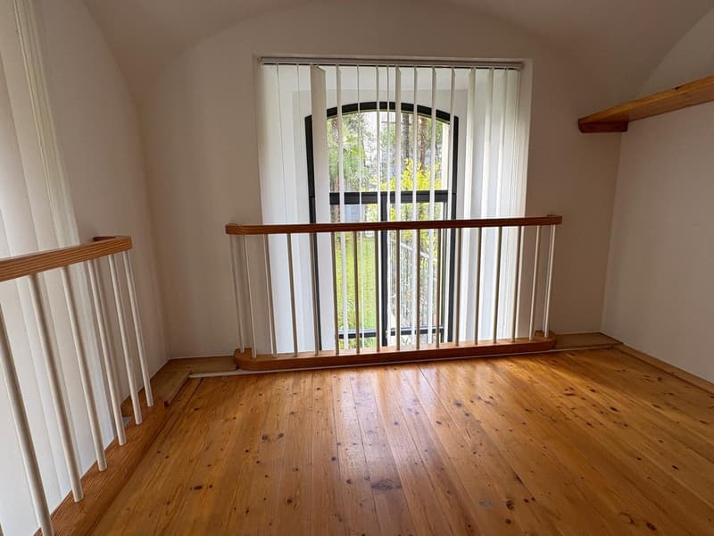 wooden floor, white walls, closed window, wooden railing