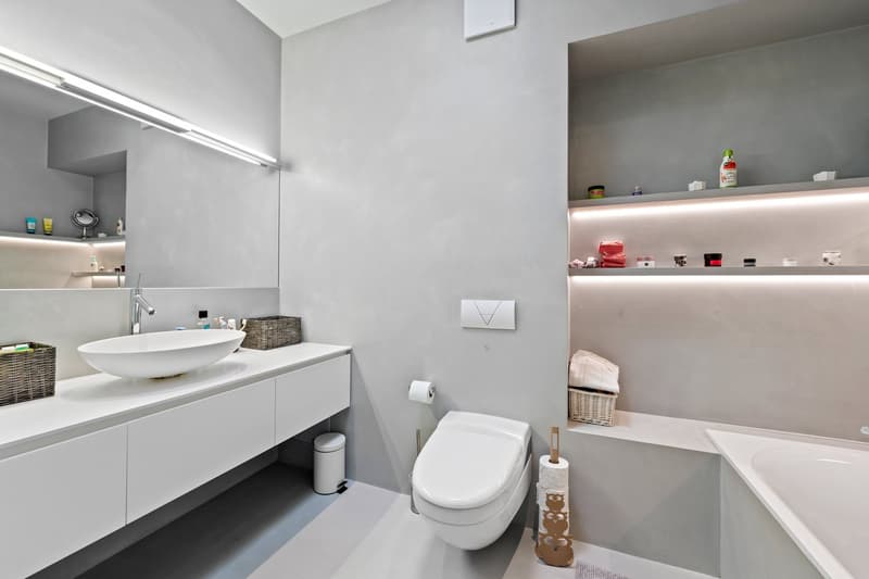 modern bathroom, white sink, modern faucet, wall-mounted toilet, modern shelves, bathtub