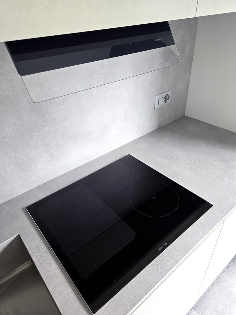 modern kitchen, induction stove, white cabinets, stainless steel countertop, modern extractor hood