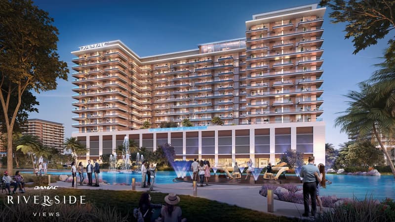 Large building with swimming pool, fountain and balconies, large open area for people to hang out