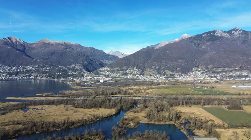 wide landscape, mountain range, lake, village