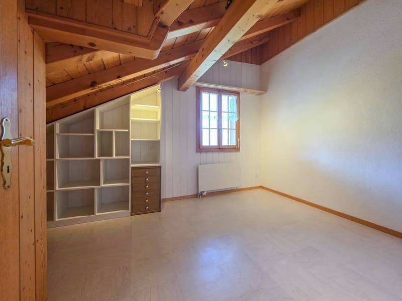 loft room, wooden ceiling, built-in wardrobes, radiator, window