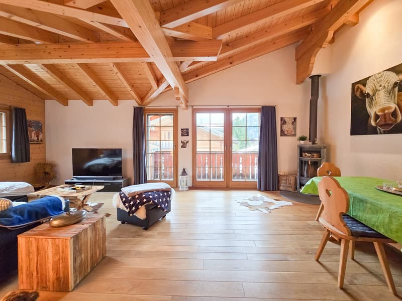 wooden ceiling, fireplace, wooden floor, large windows, dining table, chairs, couch, TV, wooden table, decorative items