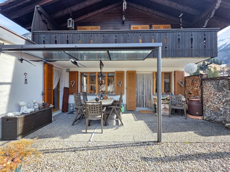 wooden house, balcony, outdoor dining area, wooden storage box, outdoor seating, wooden table, chairs, decorative items