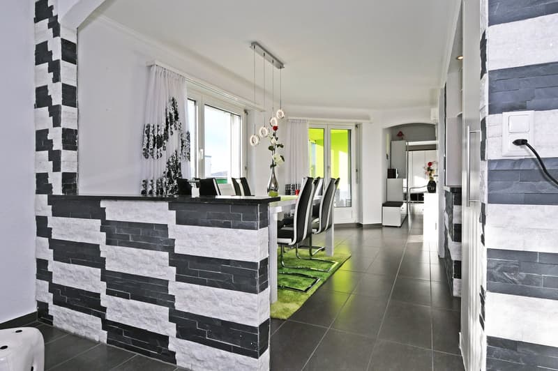 modern interior, black and white stone wall, white countertop, dining table, chairs, white curtains, white ceiling