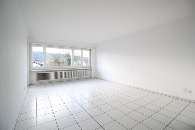 empty room, white tiles, white walls, large window, white radiator