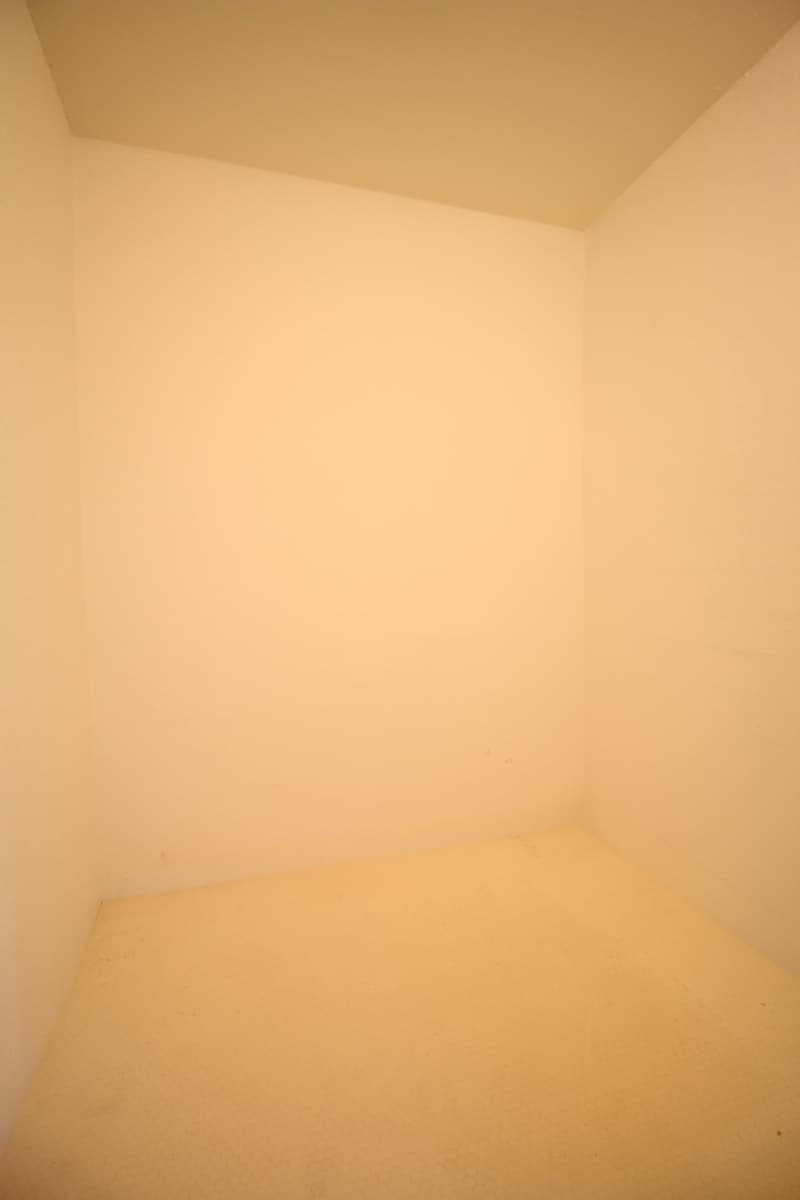 Completely empty room with bare walls and tiled floor. No furniture or equipment.