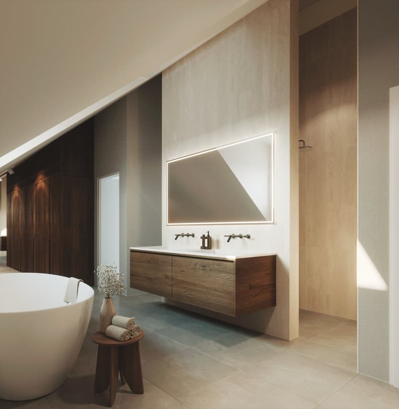 Bathroom with a large bathtub, wooden cabinet, double sink, large mirror, and wooden stool with towels