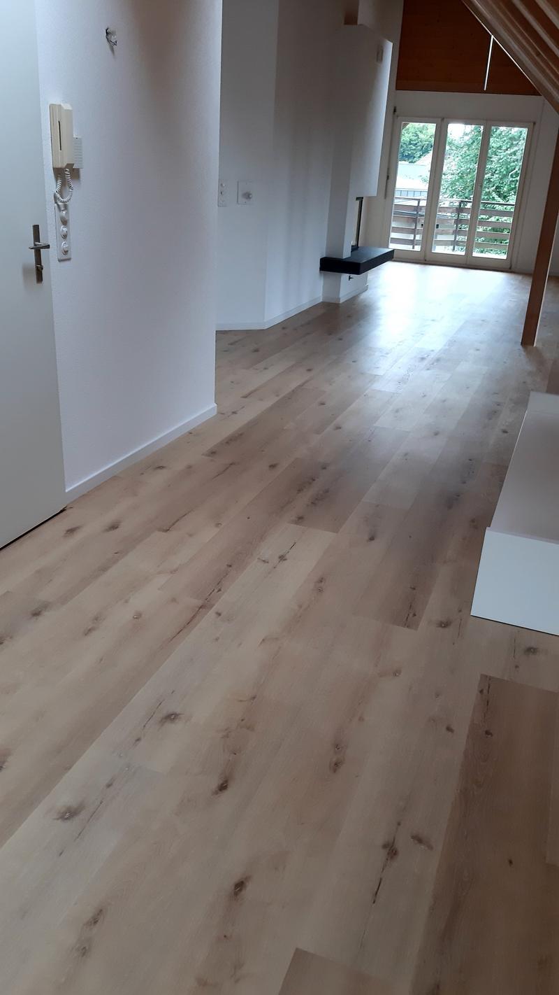 empty room, wooden floor, white walls, sliding glass doors, telephone on wall