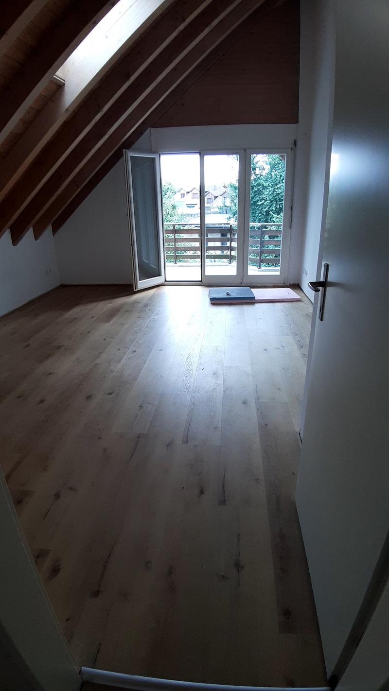 empty room, wooden floor, white walls, glass doors, balcony