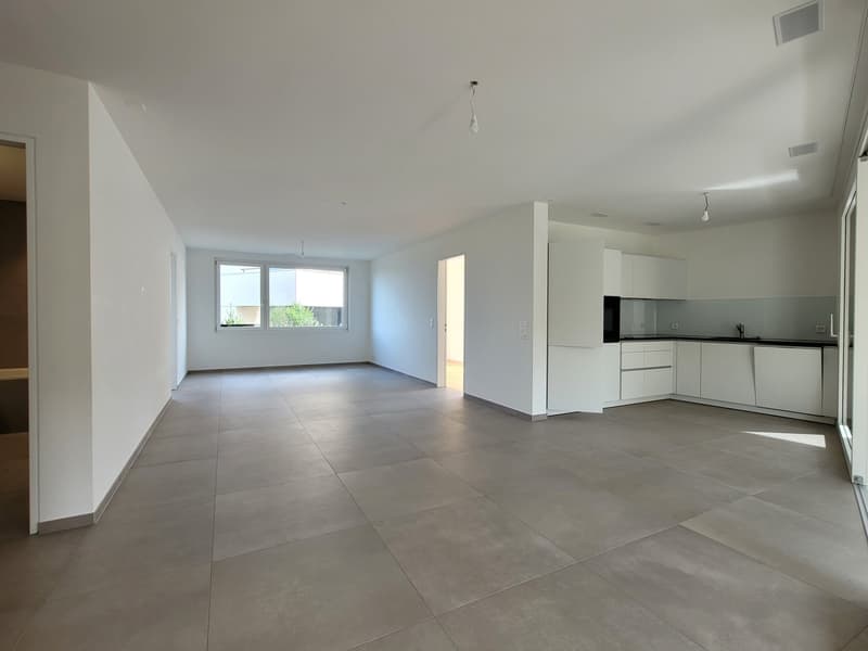 empty room, white walls, tiled floor, large window, open door, kitchen area