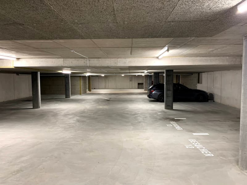 Empty parking lot with pillars and markings