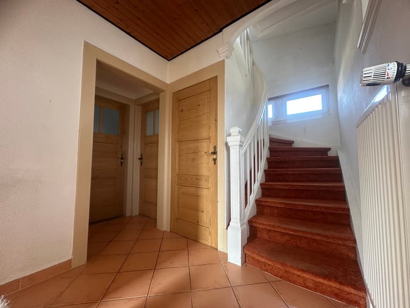 Tiled floor, wooden doors, staircase, window, wooden ceiling