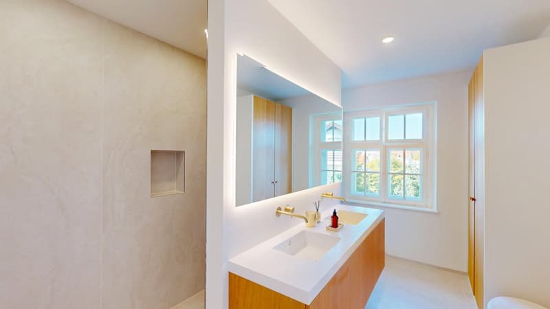 modern bathroom with a double sink, shower, large mirror, and storage shelves