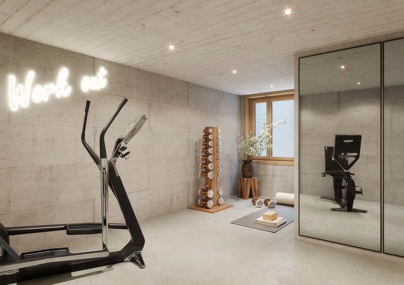 A gym space with treadmill, dumbbell rack, mirror, yoga mat, potted flower, window, exercise bike, wooden stool, and light fixtures.