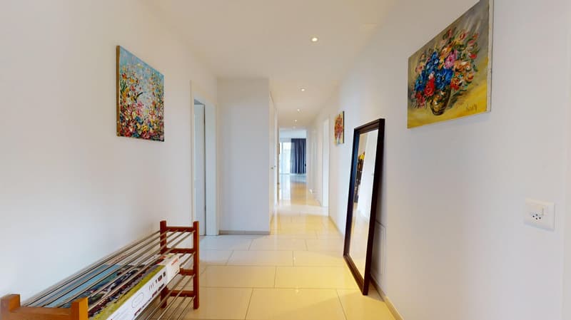 white walls, white tiles, wooden bench, paintings, mirror, power outlet