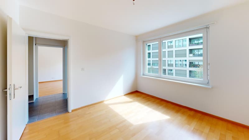 empty room, wooden floor, white walls, large window, open door