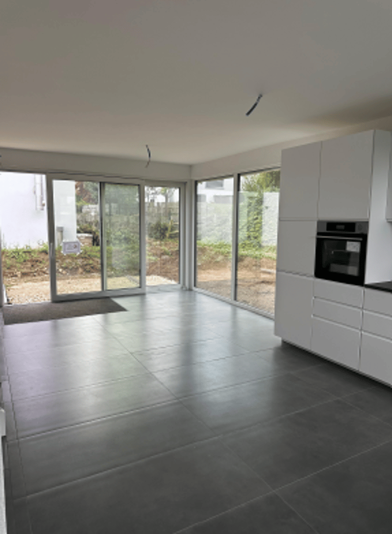 large kitchen, tile flooring, sliding doors, large windows