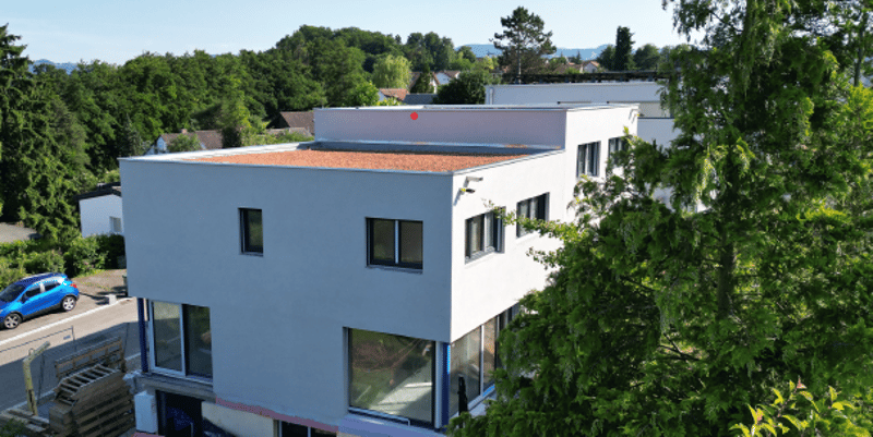 Modern 3 story house, white exterior, large windows, parking lot, scenic view