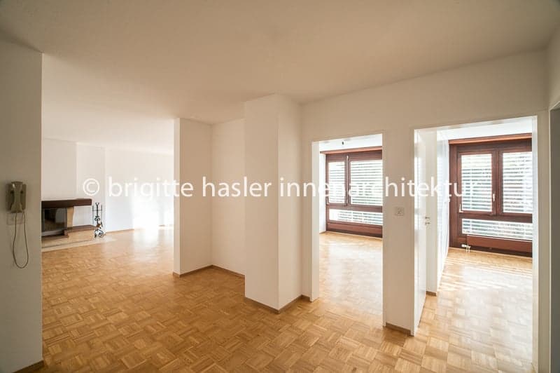 empty room, wooden floor, white walls, fireplace, windows, telephone
