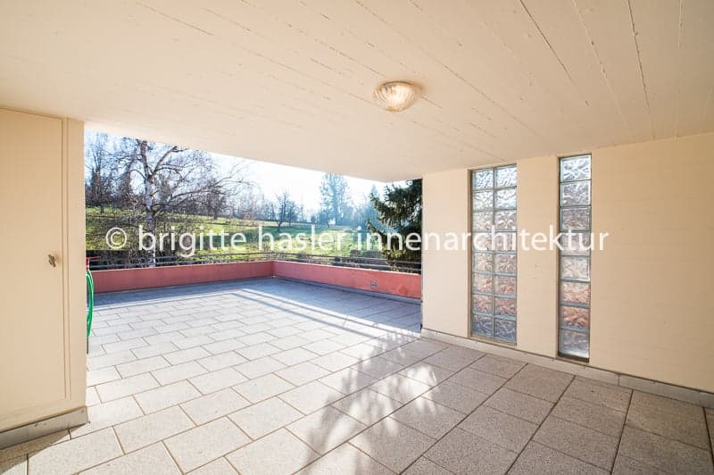 tiled floor, open balcony, glass walls, ceiling light