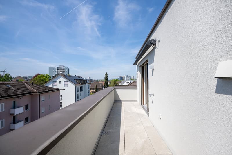 Balcony with city view, tiled floor, white walls, gray balustrade, street lights