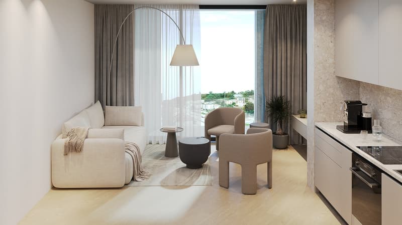 Spacious living room with large windows, beige sofa, armchairs, coffee table, and floor lamp. The room has access to a balcony or terrace with a view of the surrounding area.