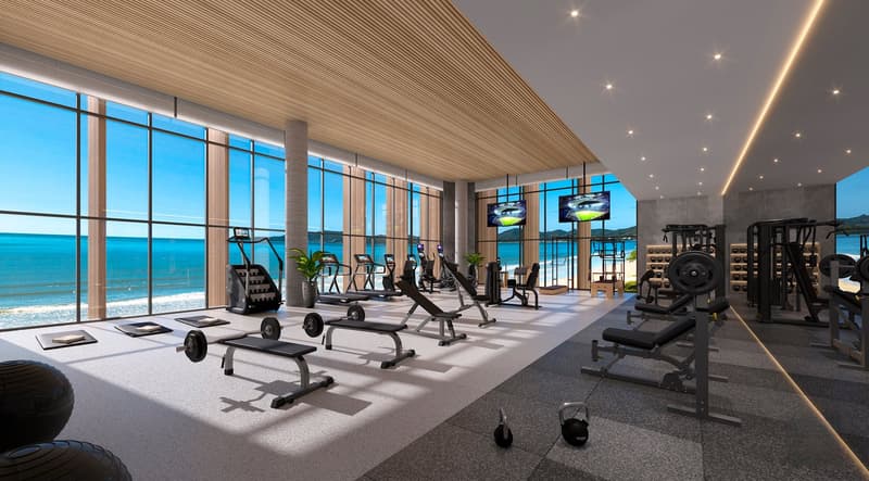 gym with large windows, modern equipment, ocean view