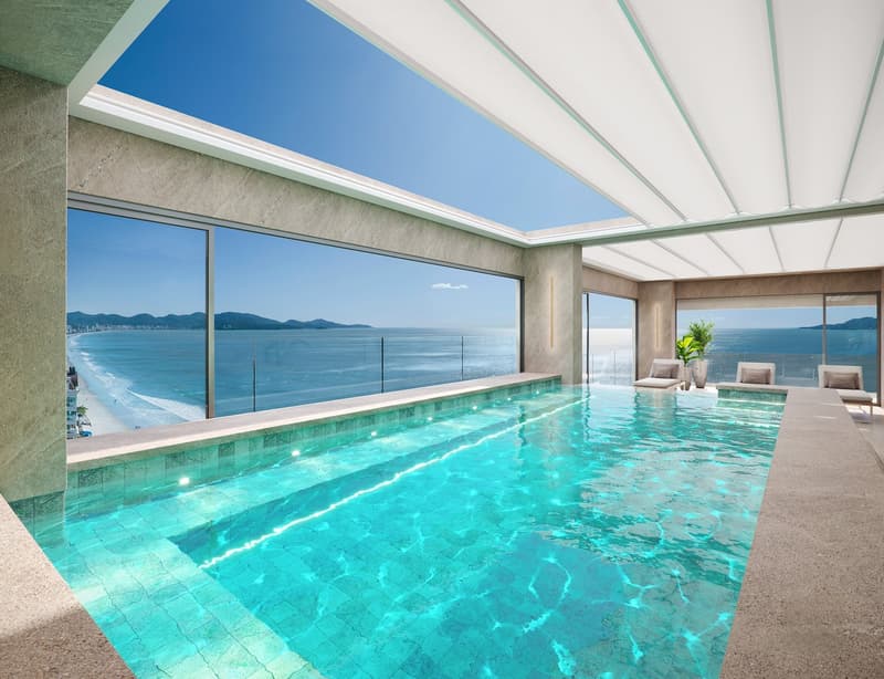 large swimming pool, glass walls, lounge chairs, potted plant, ocean view