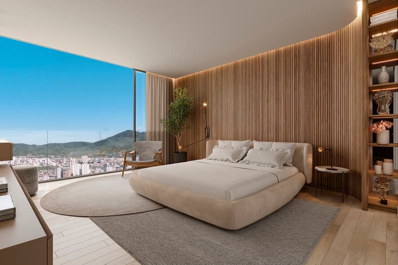 modern bedroom with large bed, wooden wall, large window, city view, rug, chair, plant, bedside tables, lamp, shelf