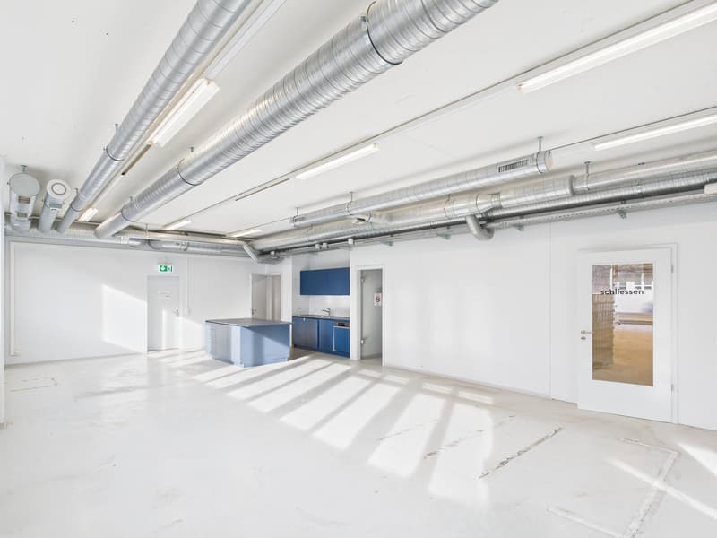 empty room, white walls, white floor, central kitchen with sink and dishwasher, cabinets, emergency exit