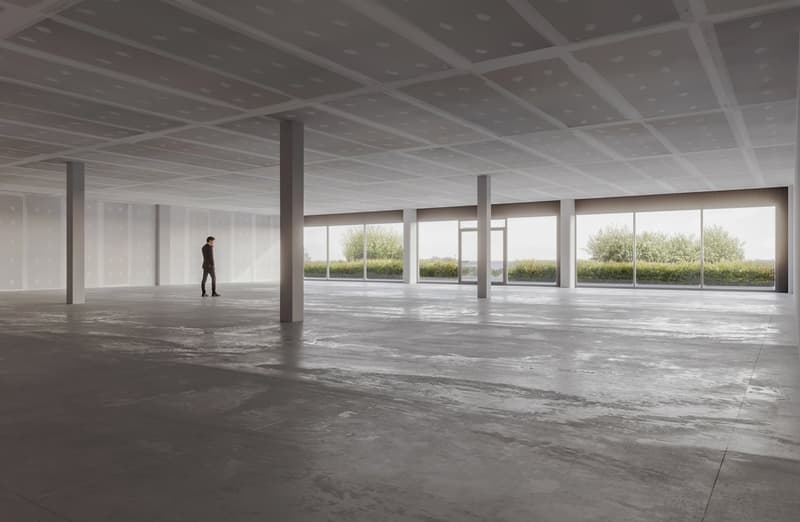 Empty room, concrete floor, white walls, large windows, high ceiling, no furniture
