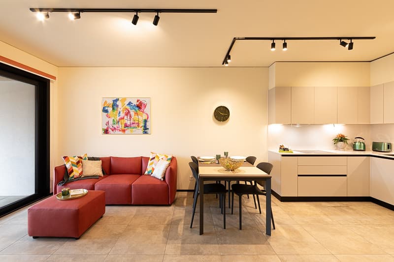 open space with living area, dining table and kitchen