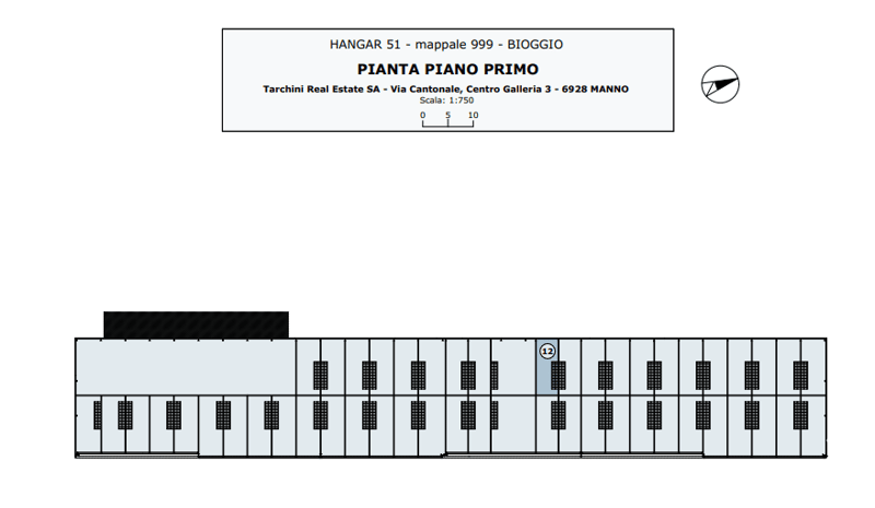 Floor plan of a building with multiple rooms and a central corridor