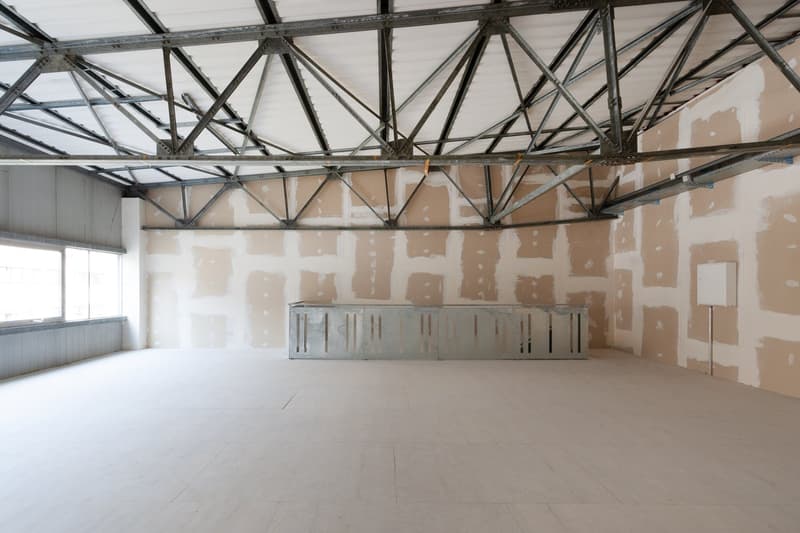 empty room, metal ceiling, tiled floor, unfinished walls, windows
