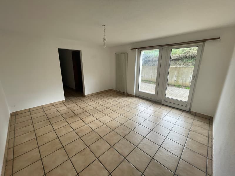 empty room, white walls, tiled floor, sliding glass doors, white ceiling, white radiator