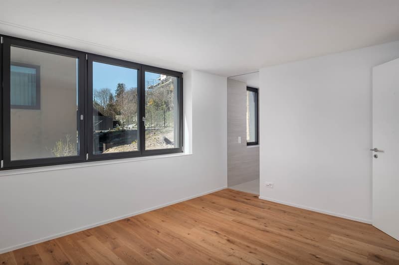 empty room, large windows, wooden floor, white walls