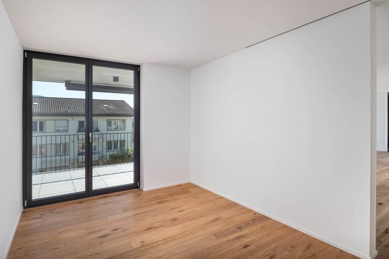 empty room, wooden floor, white walls, sliding glass door, balcony