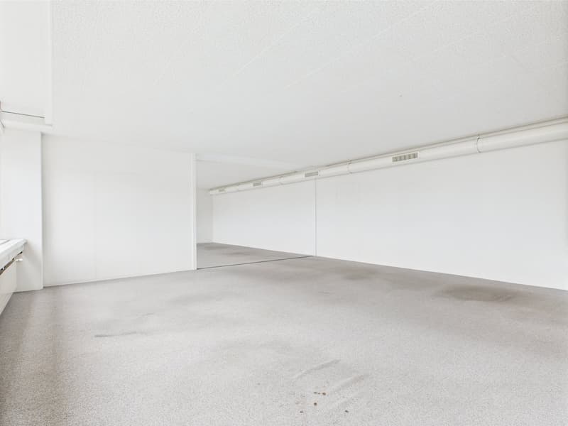 Large room, empty, white walls, ceiling, floor, empty parking space, ventilation pipes