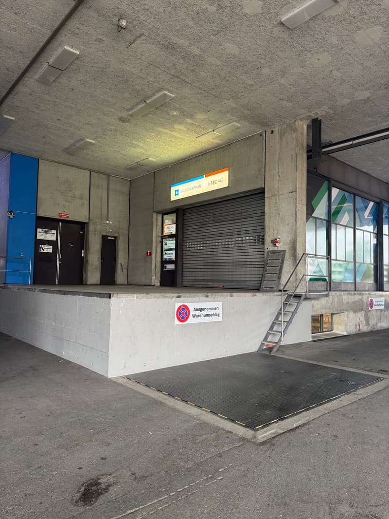 underground parking area, 2 doors, metal stairs, loading platform