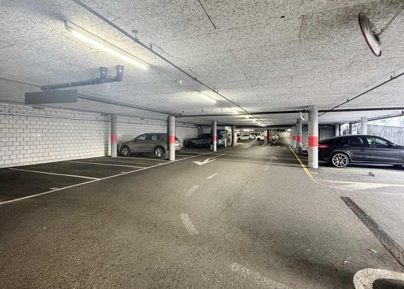 underground parking space with cars parked