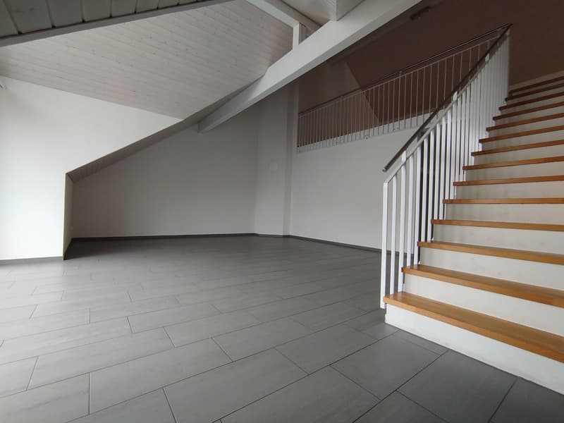 empty room, tiled floor, white walls, metal railings, staircase