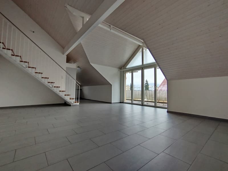 white walls, gray tiles on the floor, white wooden staircase, glass doors