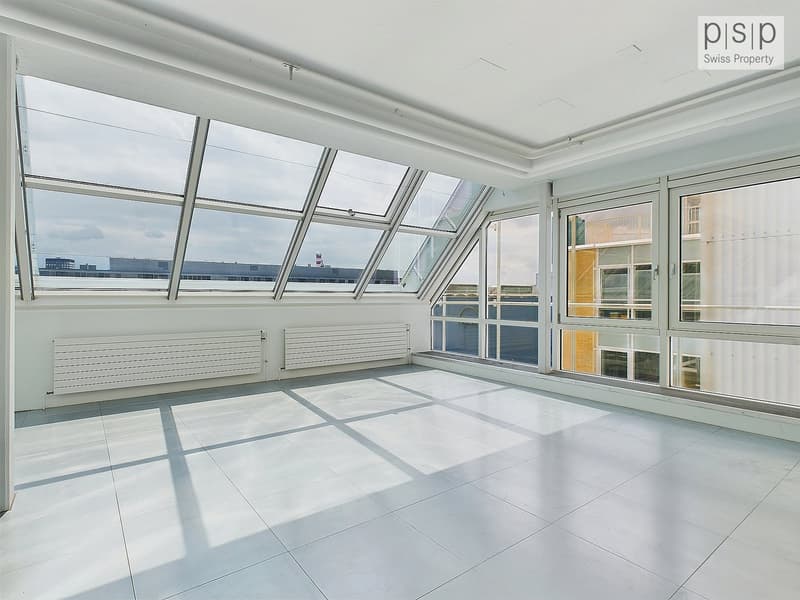 Large windows, balcony, tiled floor, white walls, view of the city