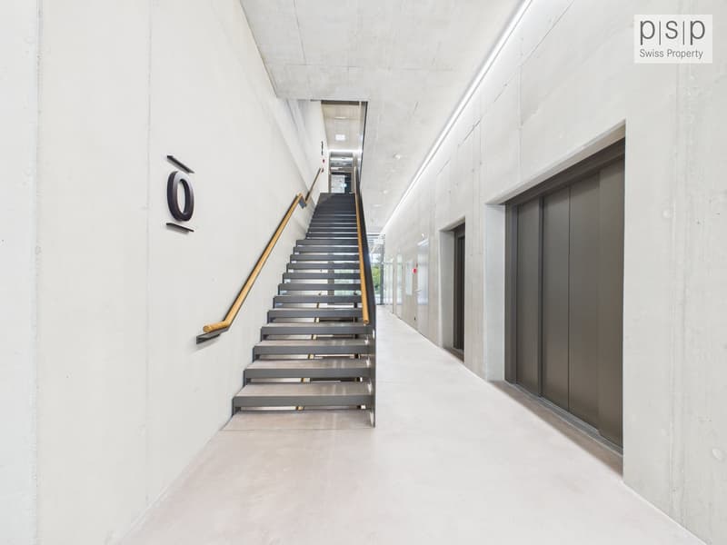 modern minimalist stairwell, white walls, grey stairs, brass railings, white tiled flooring