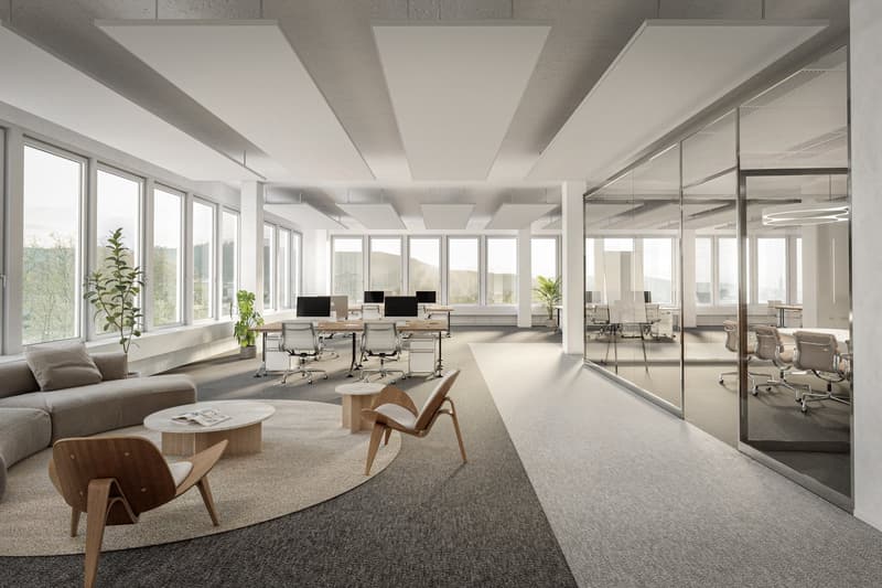 office setting with desks, chairs, couches, windows, lamps, tables