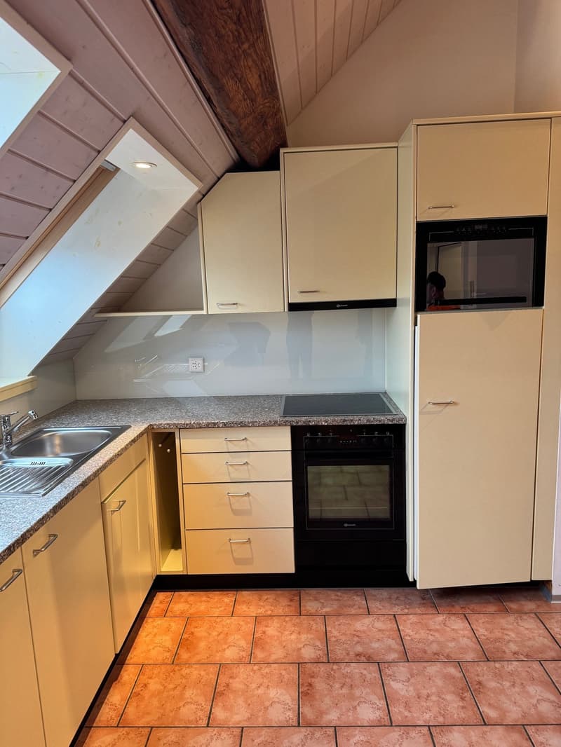 kitchen with white cabinets, granite countertop, black oven, microwave, sink, faucet, tiled floor